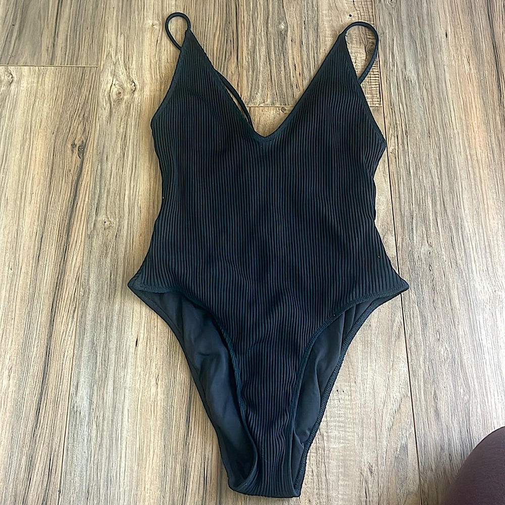 Minimale black ribbed one piece swimsuit. From Free People. Size medium. NWT